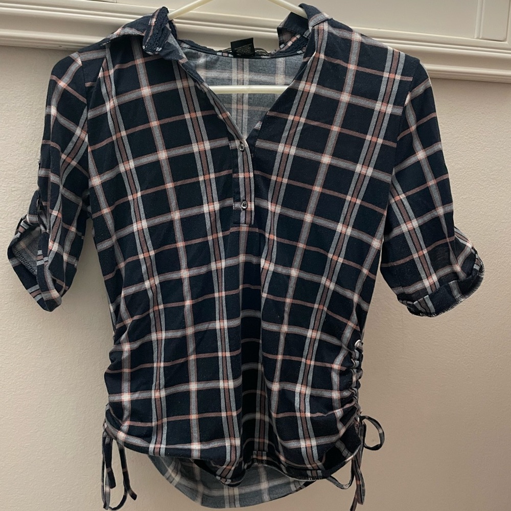 Dark blue/ pink plaid blouse that accentuates the curves. Small sized